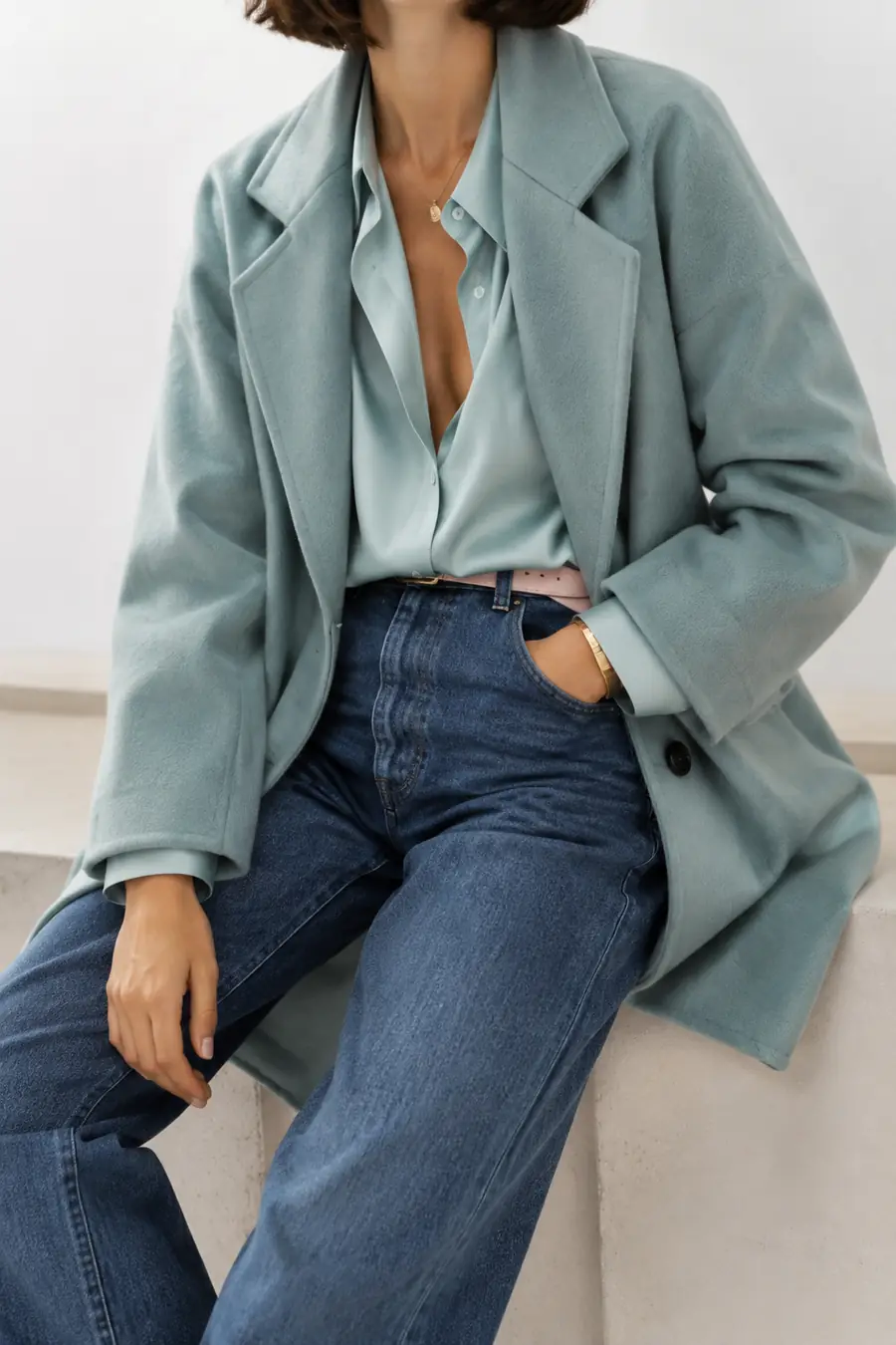 Fashion model wearing a coordinated look in a clean editorial scene