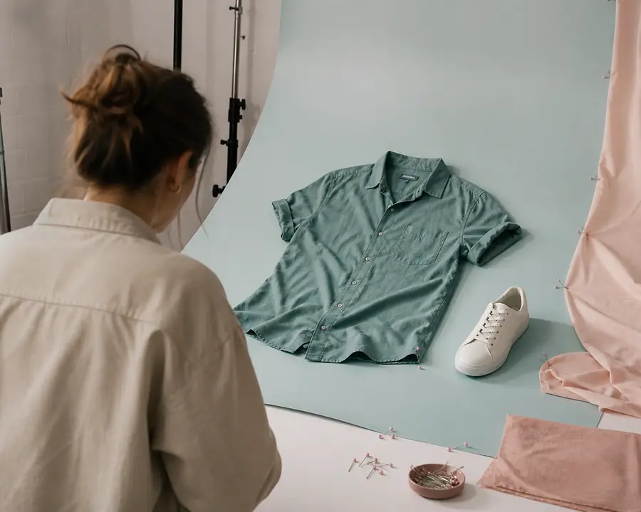 Before image showing a garment source photo prepared for a packshot